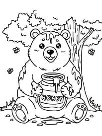 Cet ours se r&eacute;gale avec son pot de miel